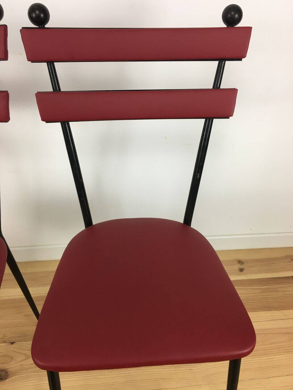 Pair of 1950s chairs in metal and red faux leather, Gueden-Adnet style.