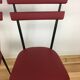 Pair of 1950s chairs in metal and red faux leather, Gueden-Adnet style.