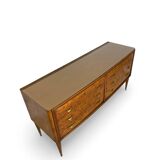 Veneered burl walnut chest of drawers with light warm brown glass top