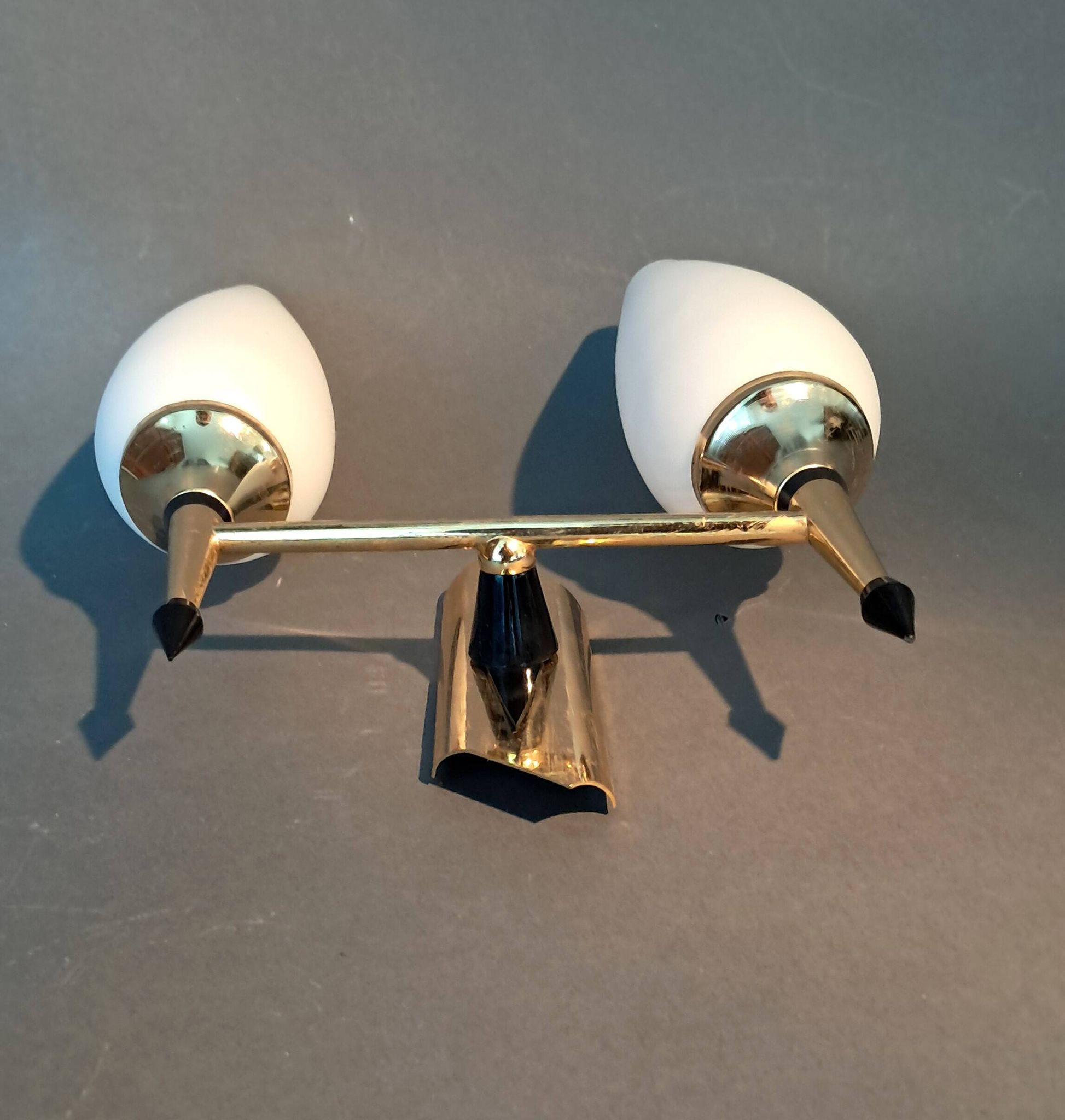 Small two-light wall lamp, white opaline and gilded brass, Circa 1960.