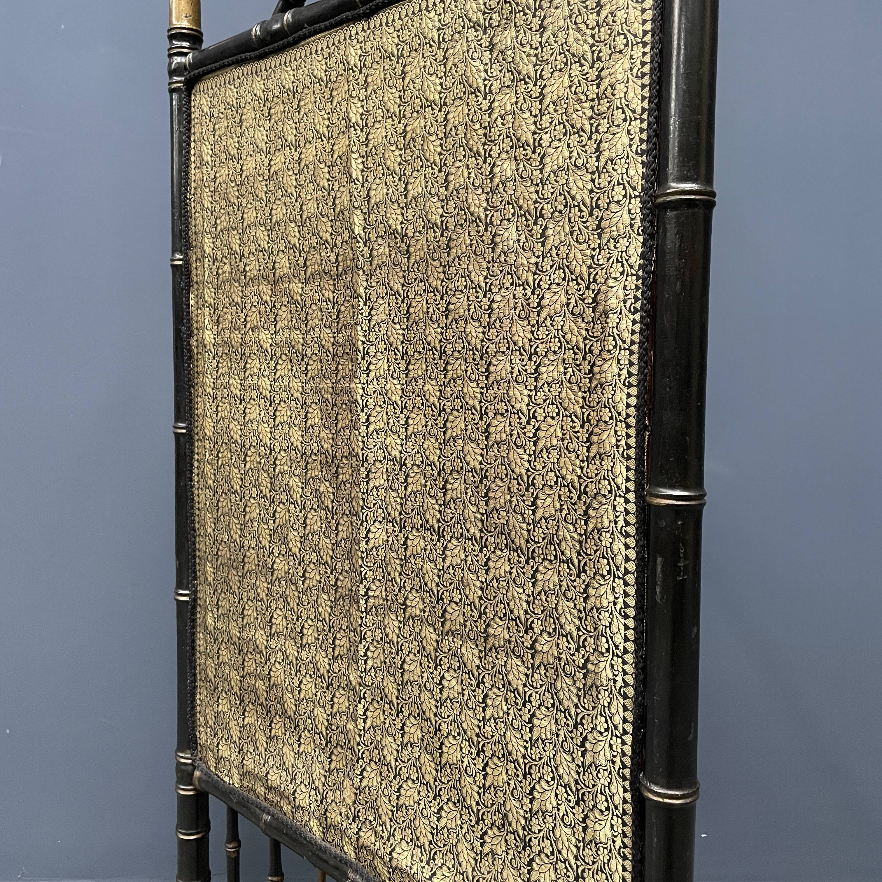 Antique black and gold faux bamboo fireplace screen