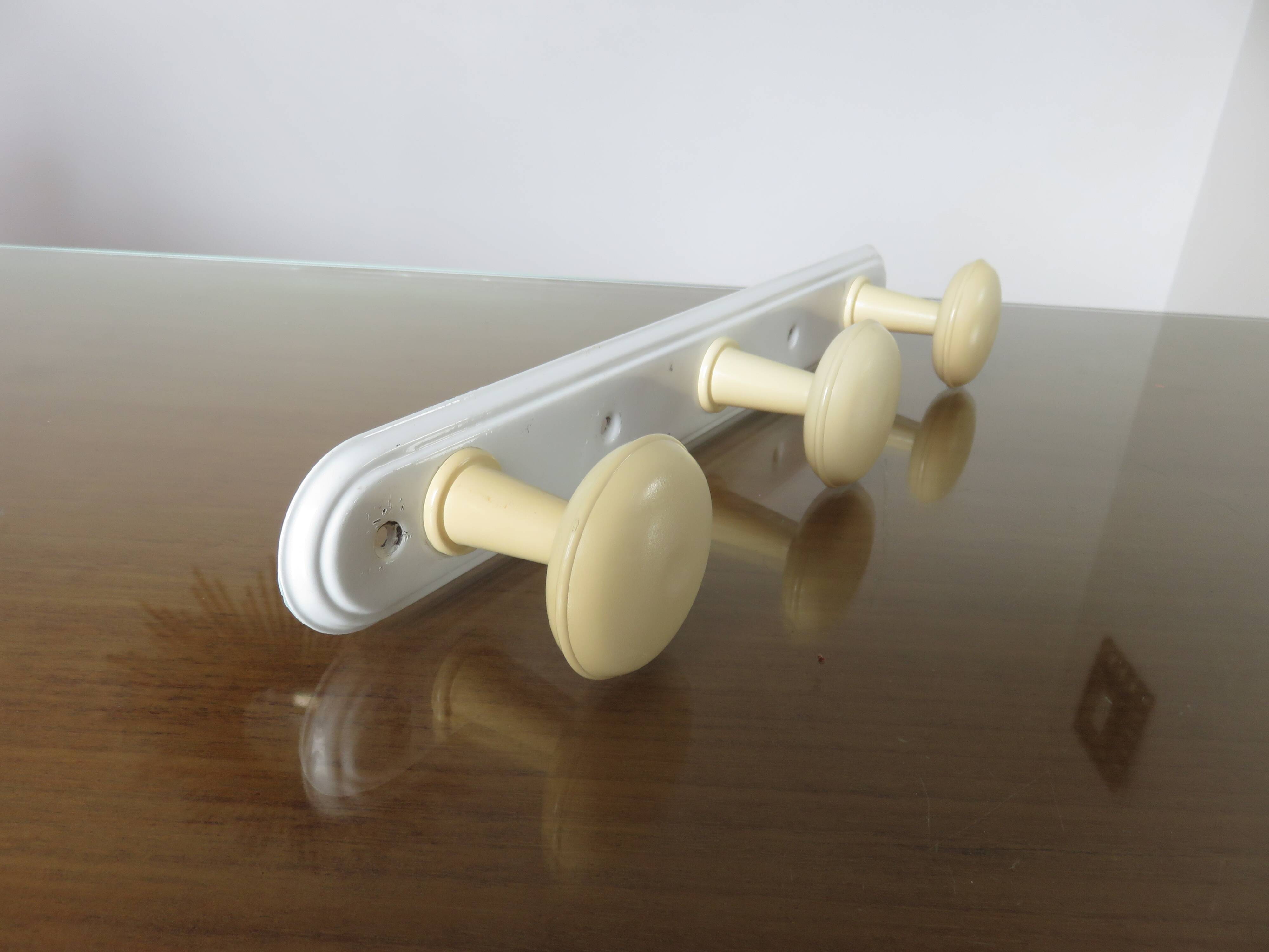 Wall coat rack with 3 coat hooks in bakelite from the 50s and 60s