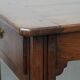 Antique French farmhouse table with two drawers and an extendable leaf.
