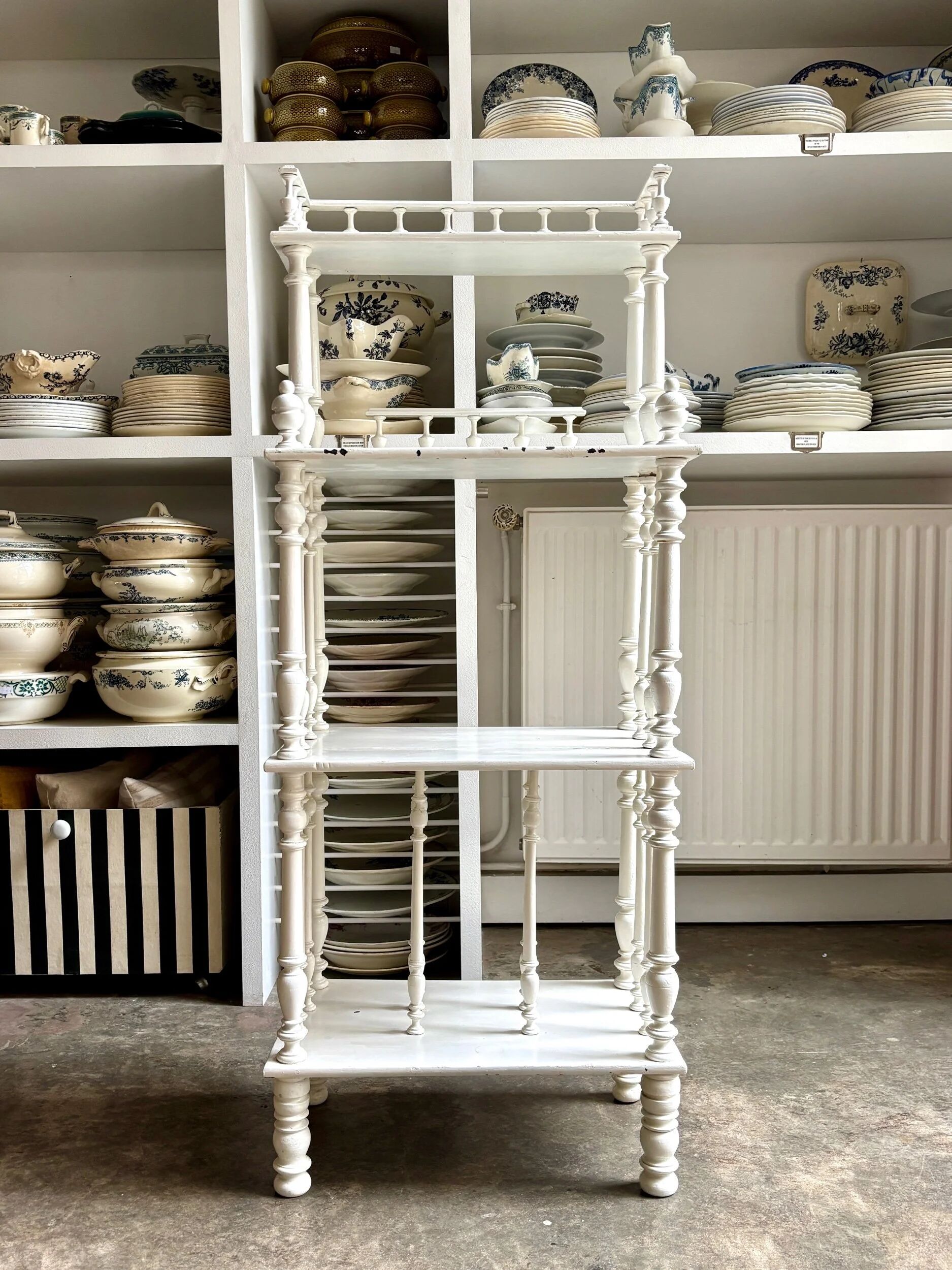 Library, white wooden sheet music cabinet.