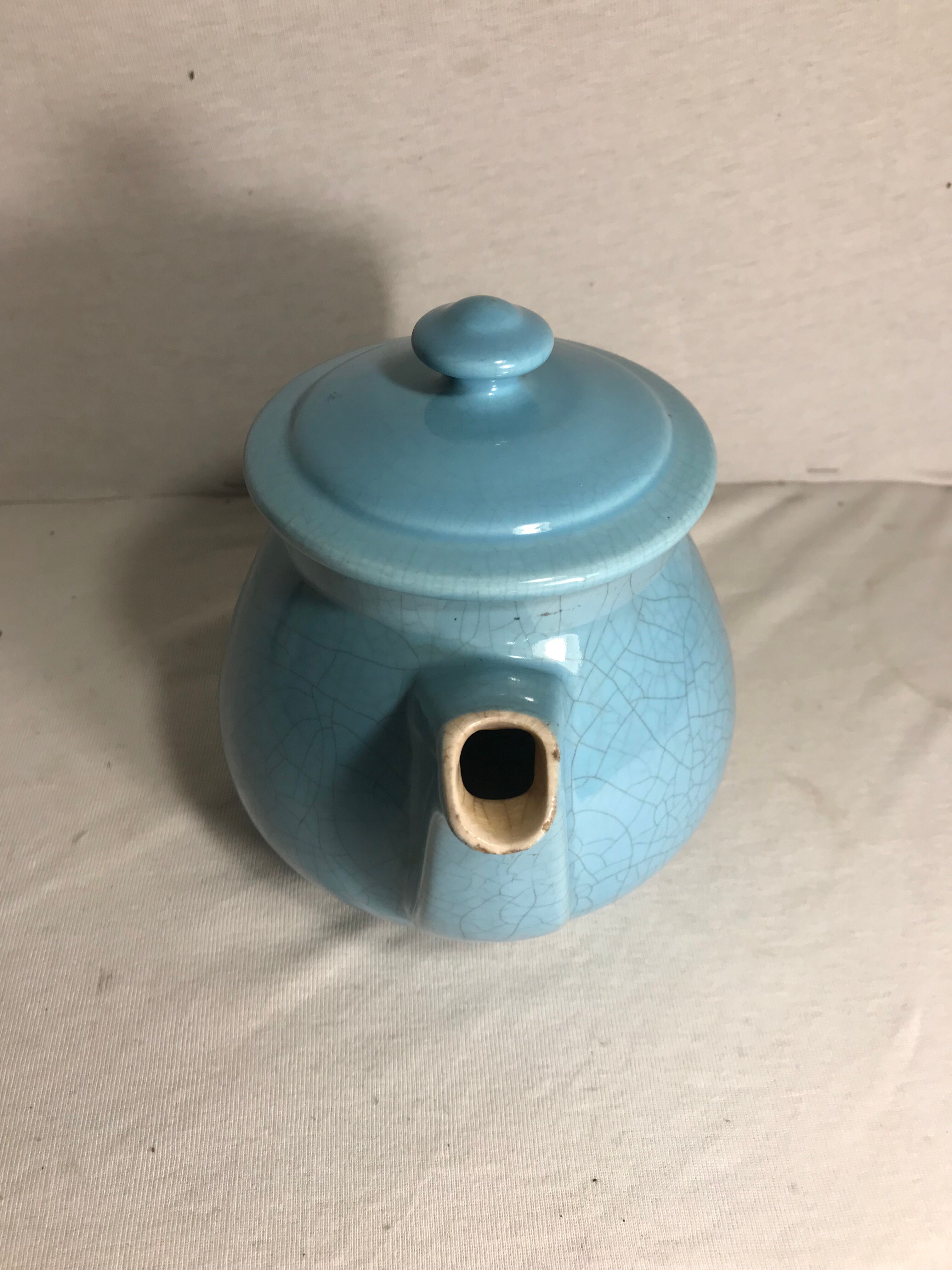 Cracked blue ceramic vintage teapot