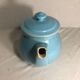 Cracked blue ceramic vintage teapot