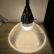 Vintage globe-style holophane on a chrome stem.