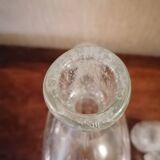 Clear bubble glass bottle molded for easy manual gripping