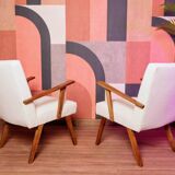 Vintage beige bouclé armchair with walnut wood from the 1950s.