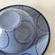 A pair of glazed ceramic cups and saucers from the 60s-70s.