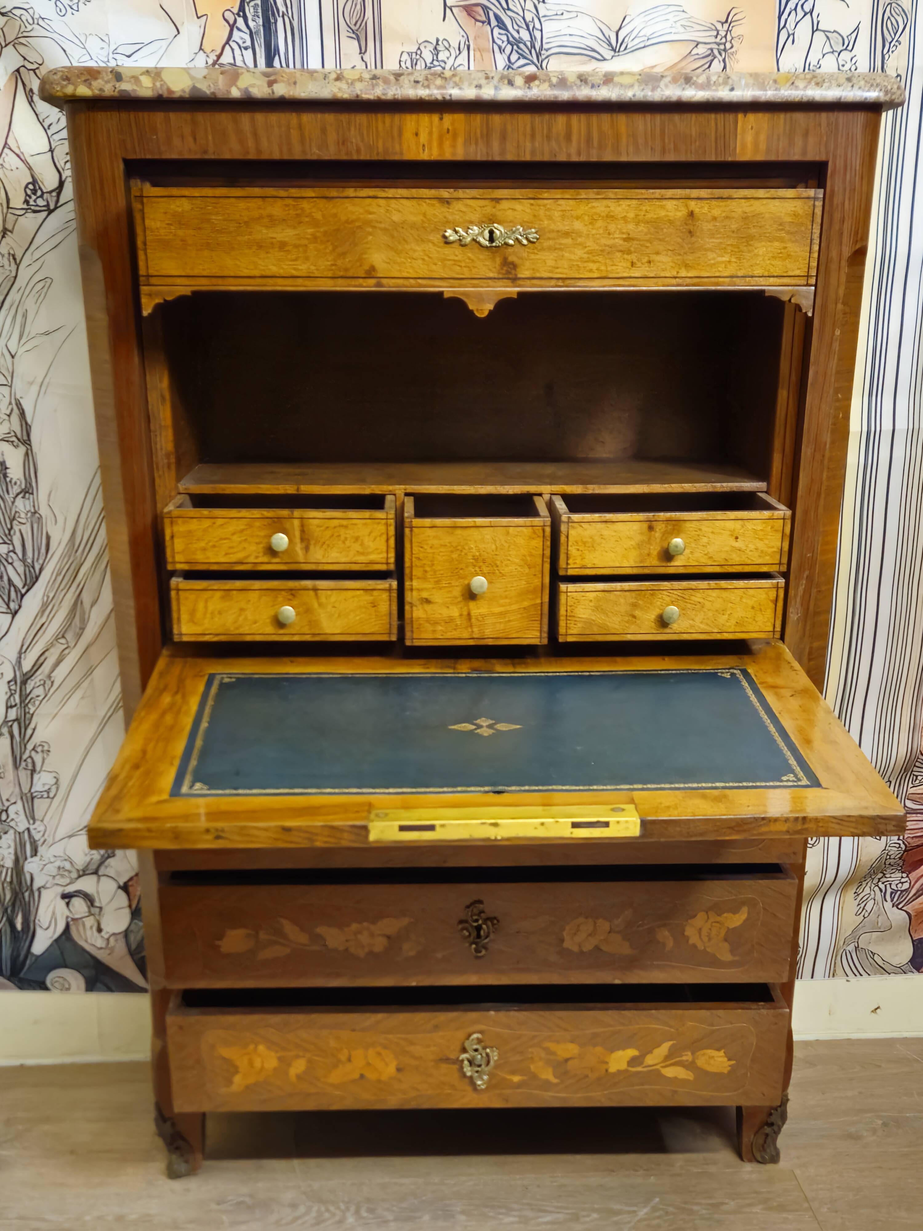 Secretary with a curved drop-leaf in floral marquetry, mid-19th century.