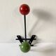 Small double coat hook in metal and wood painted green and red, 1950s-60s