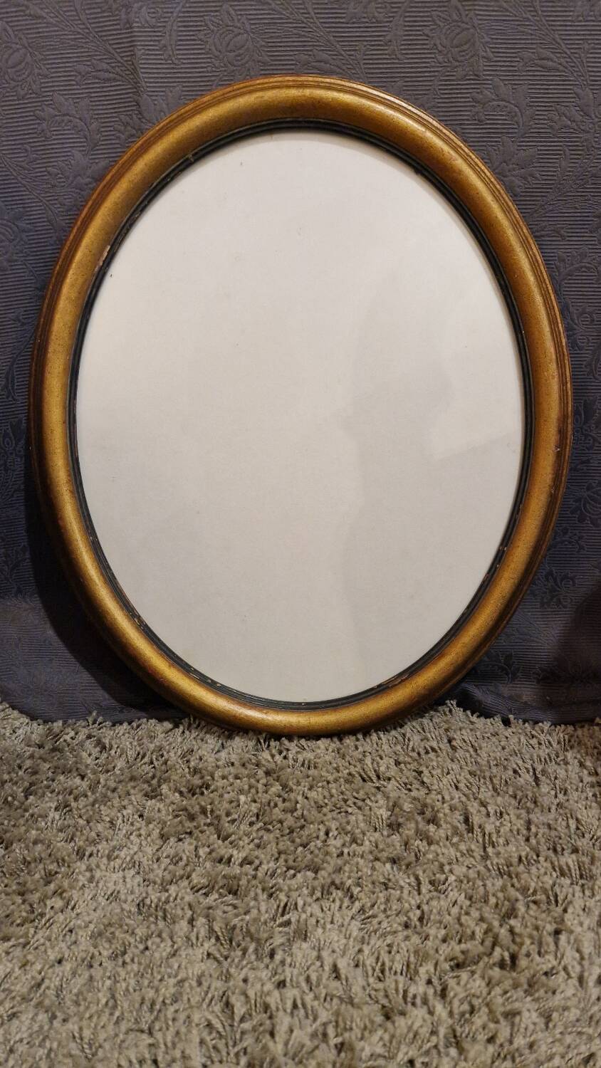 Golden oval frame