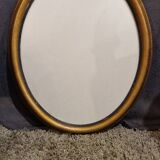 Golden oval frame