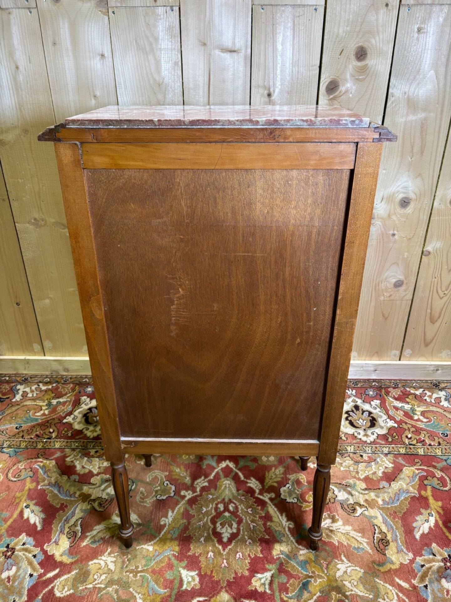 Louis XVI style molded and carved walnut chest of drawers