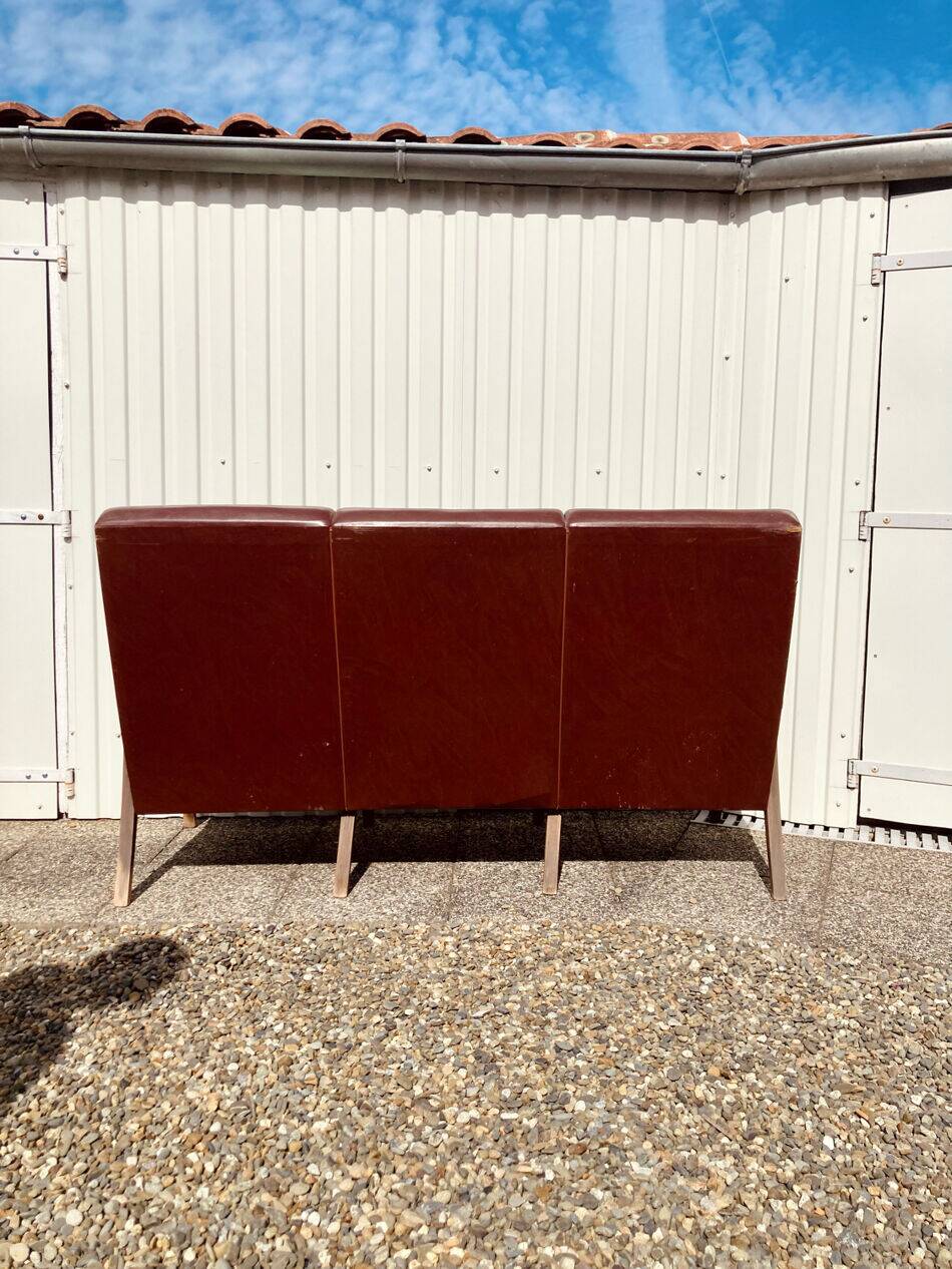 Three-seater patinated leather sofa, mid-century style.