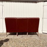 Three-seater patinated leather sofa, mid-century style.