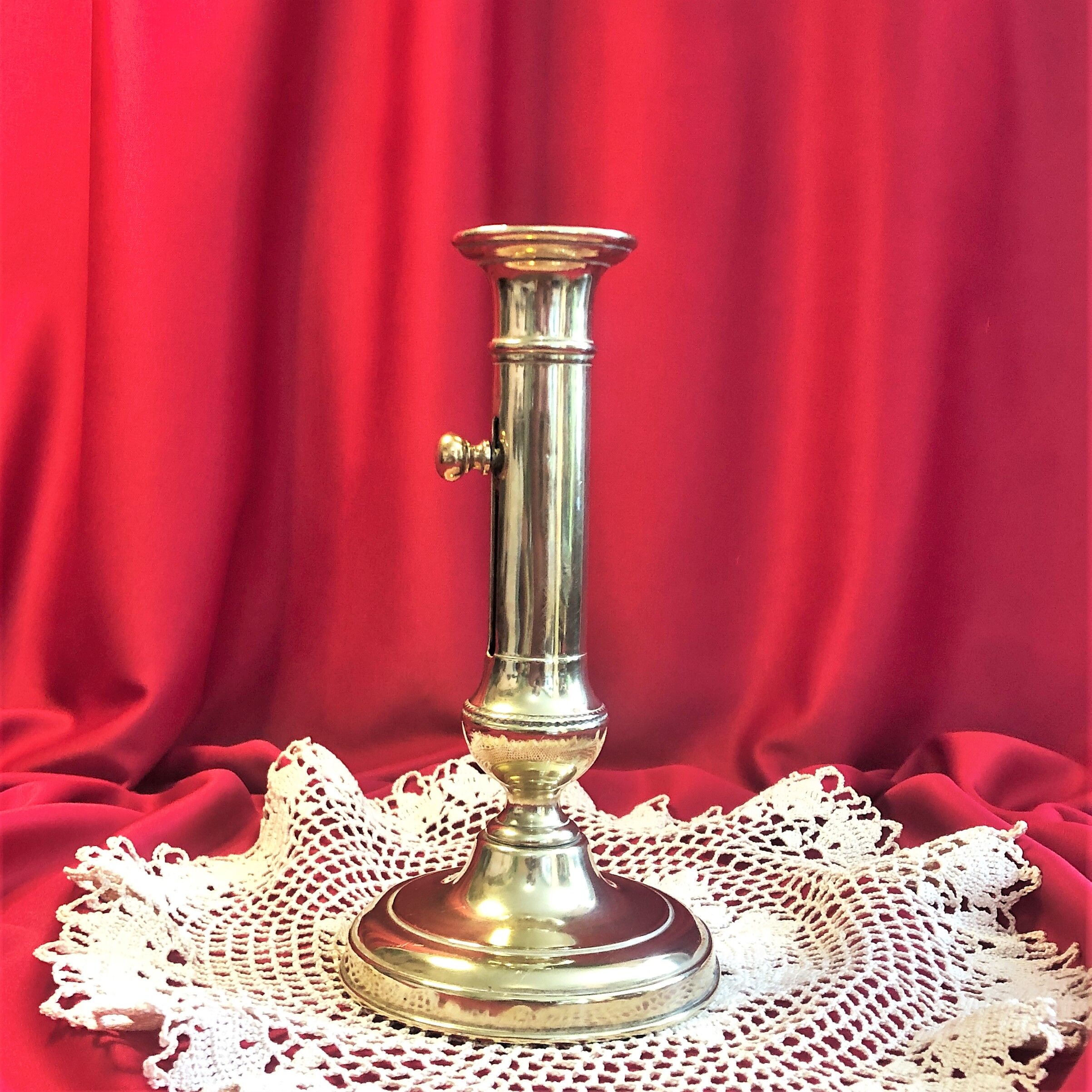 Gilded copper push candle holder