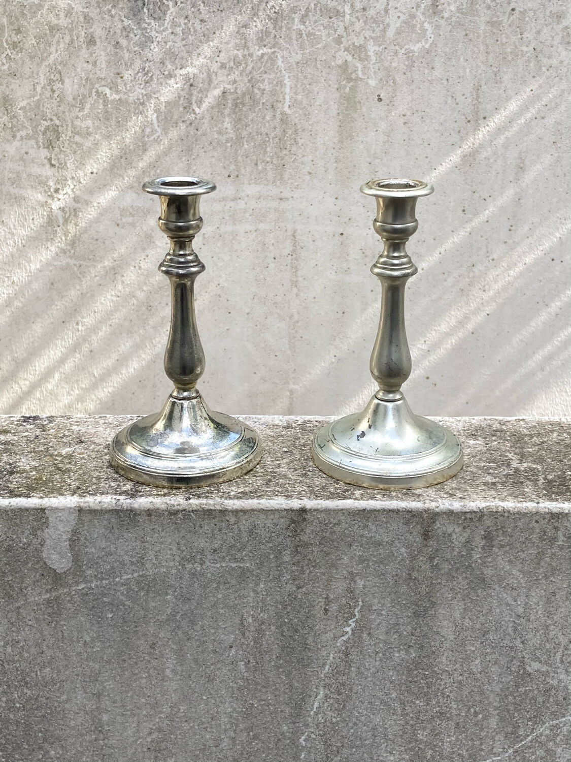 Two antique candle holders