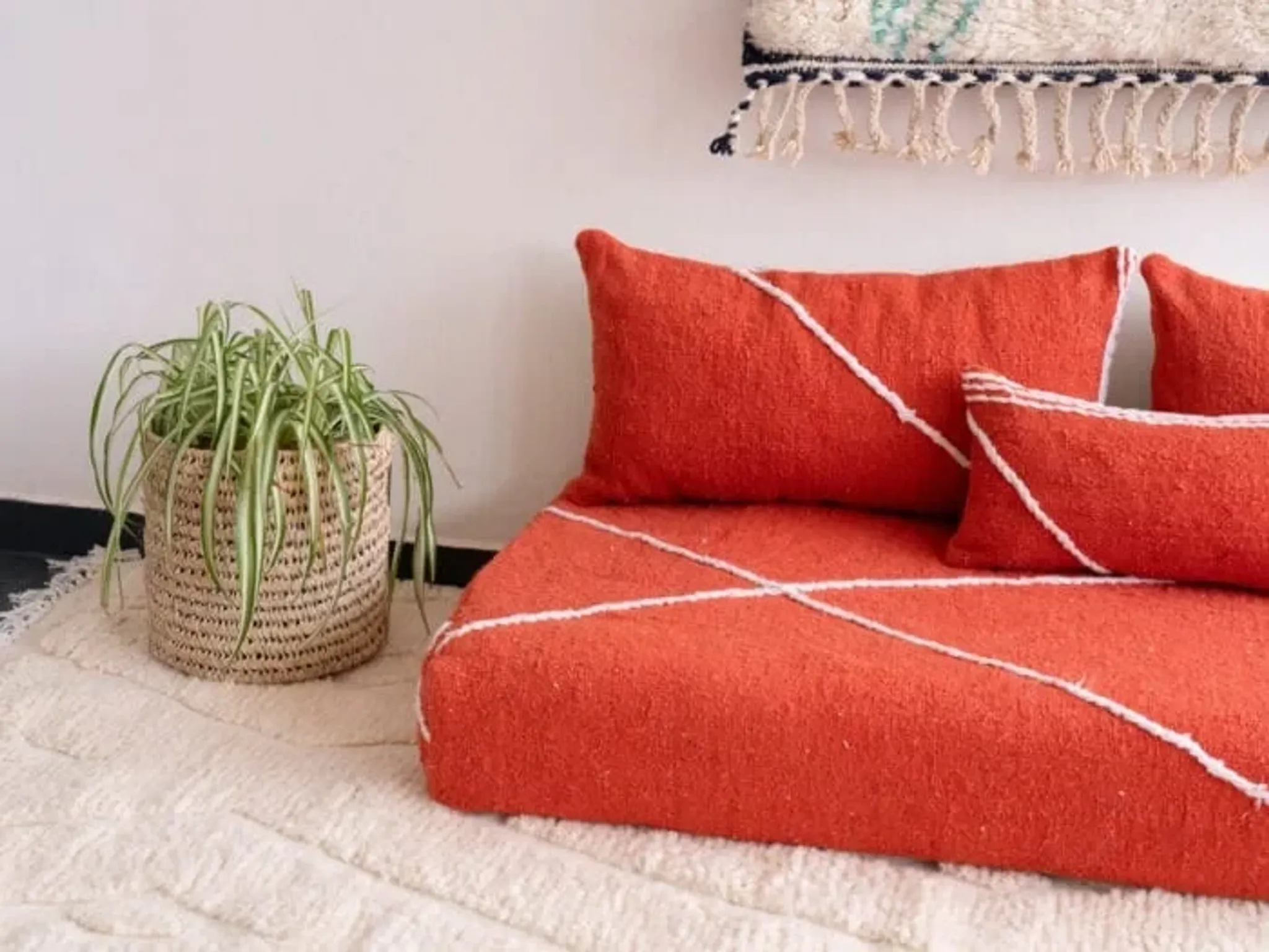 Handmade Moroccan floor cushion in orange cotton.