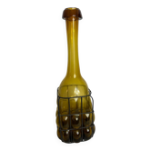 Carafe en verre enchâssée dans du fer forgé