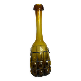 Glass carafe encased in wrought iron