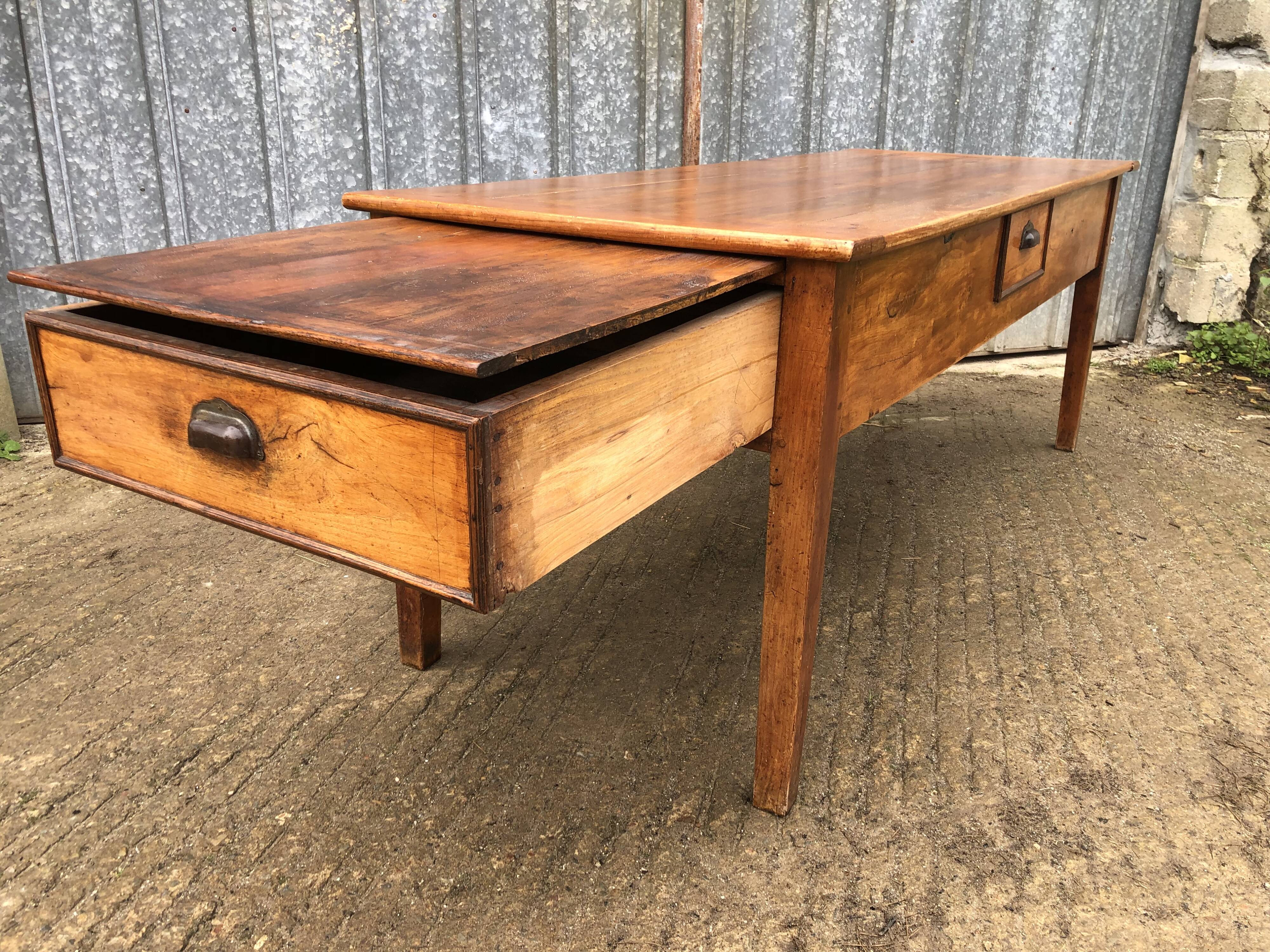 Antique farmhouse table in solid cherry wood with 3 drawers and 1 pull-out.