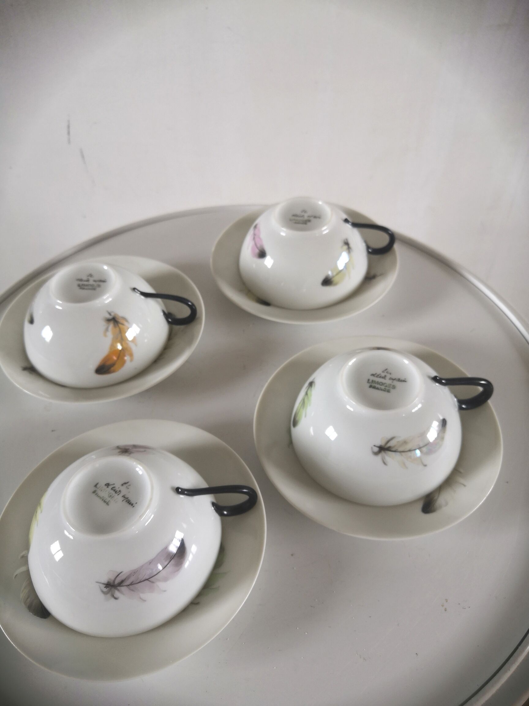 4 cups and cups in fine Limoges porcelain signed LC 60s