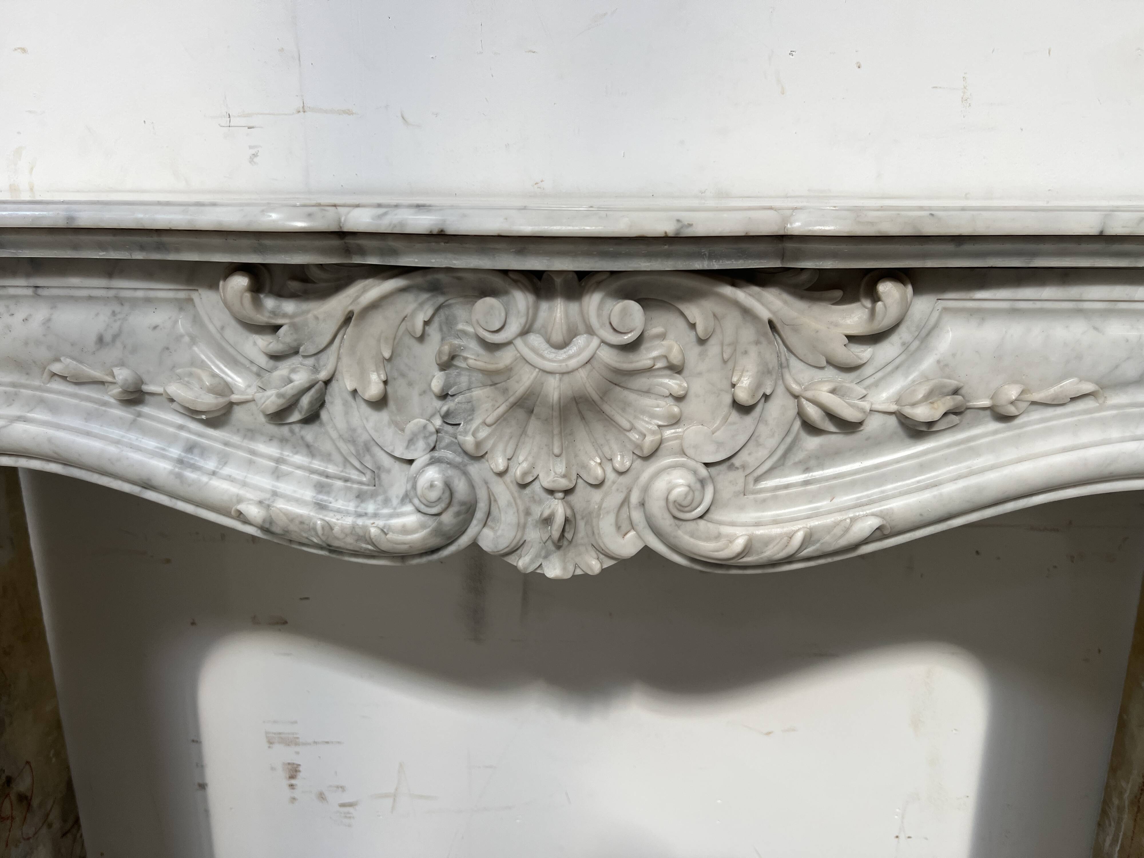 Louis XV style white Carrara marble fireplace, 19th century.