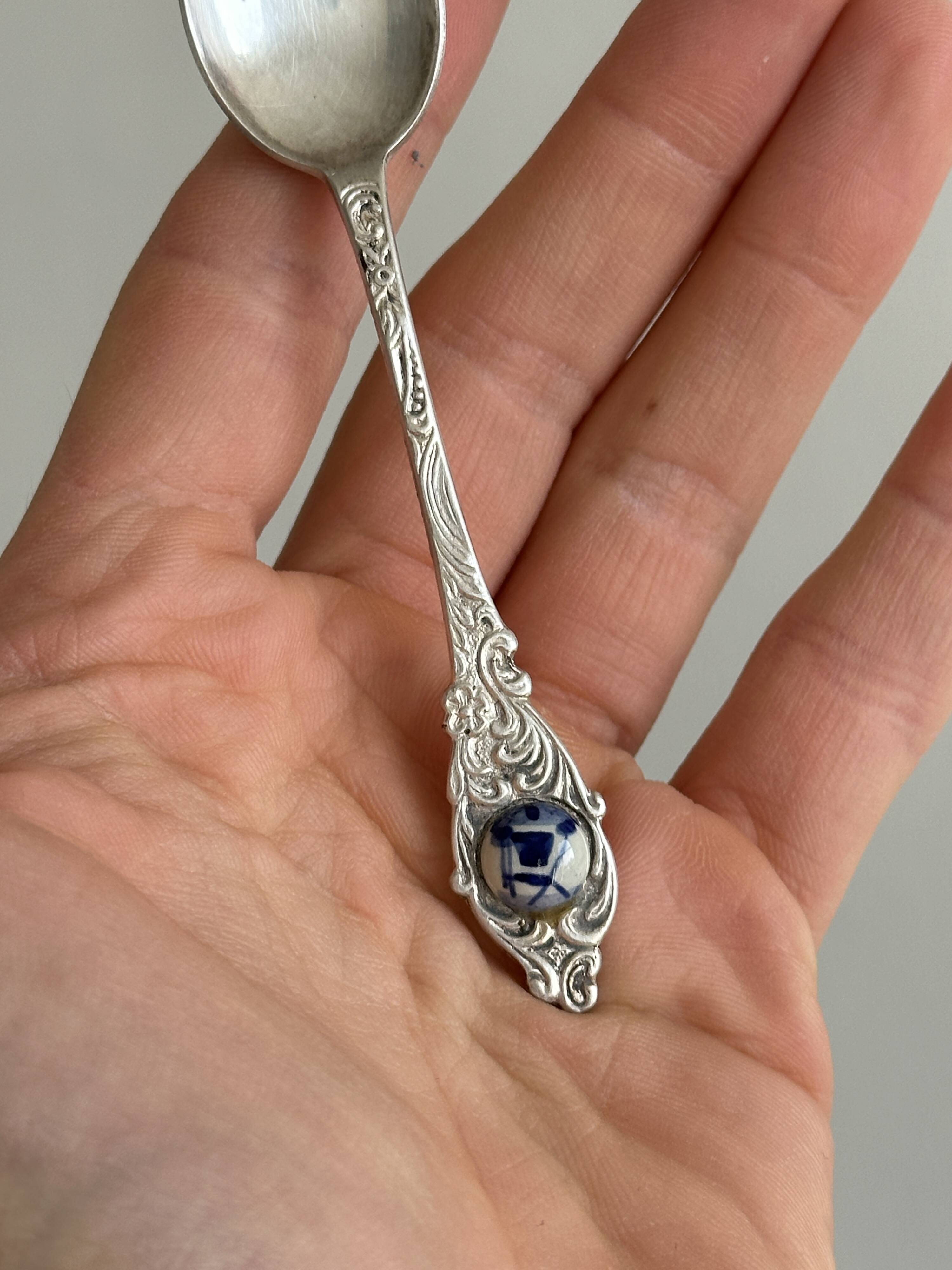 Two small metal spoons