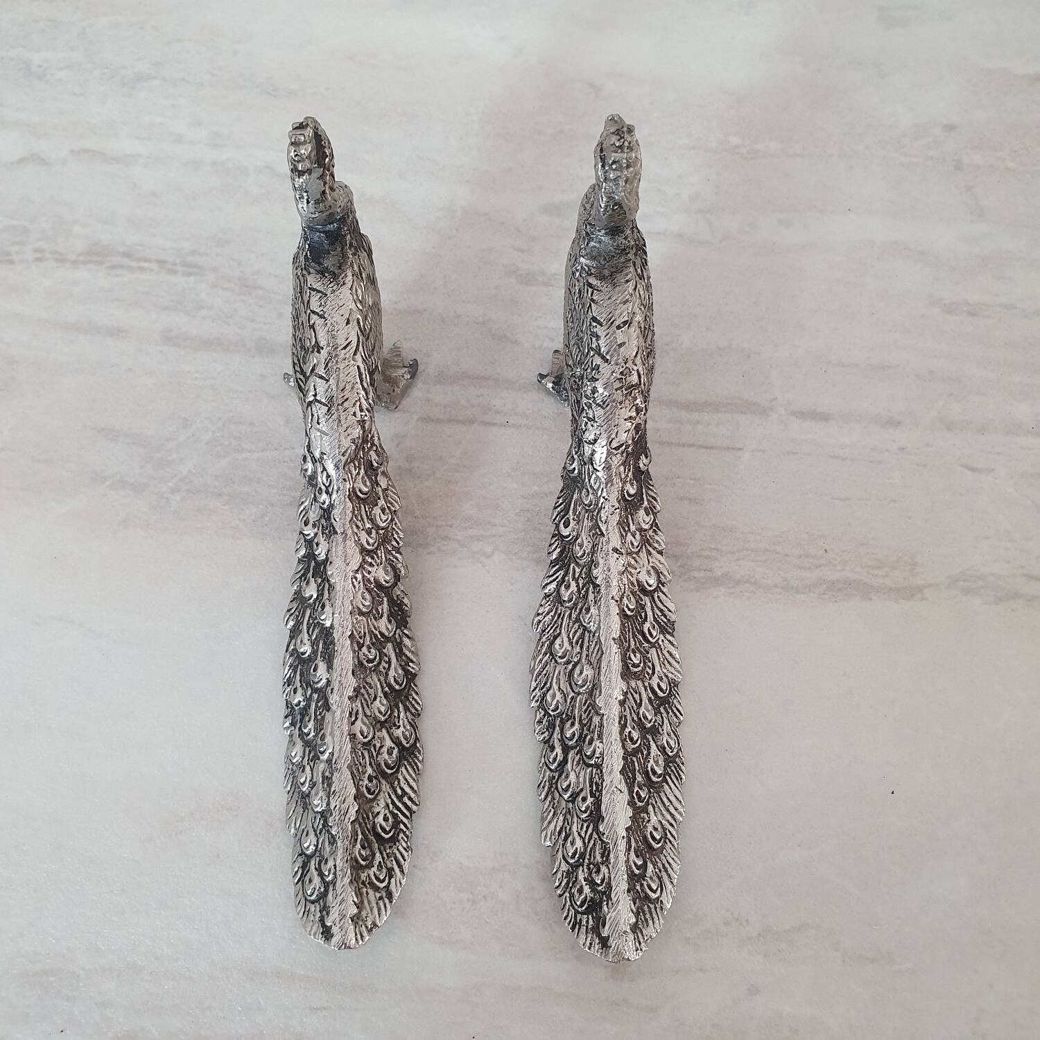 Silver metal peacock