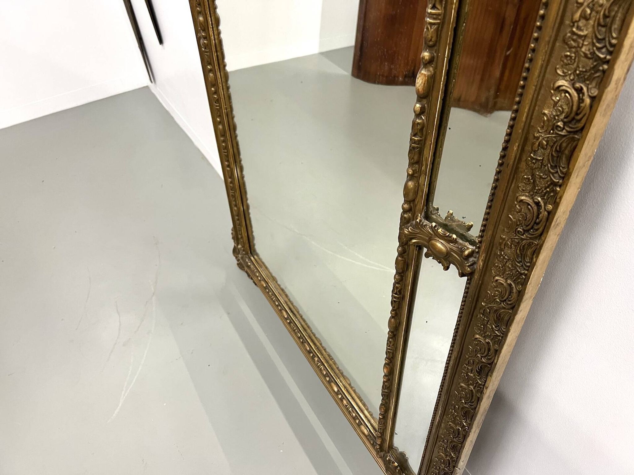 Large antique pediment mirror with mouldings.