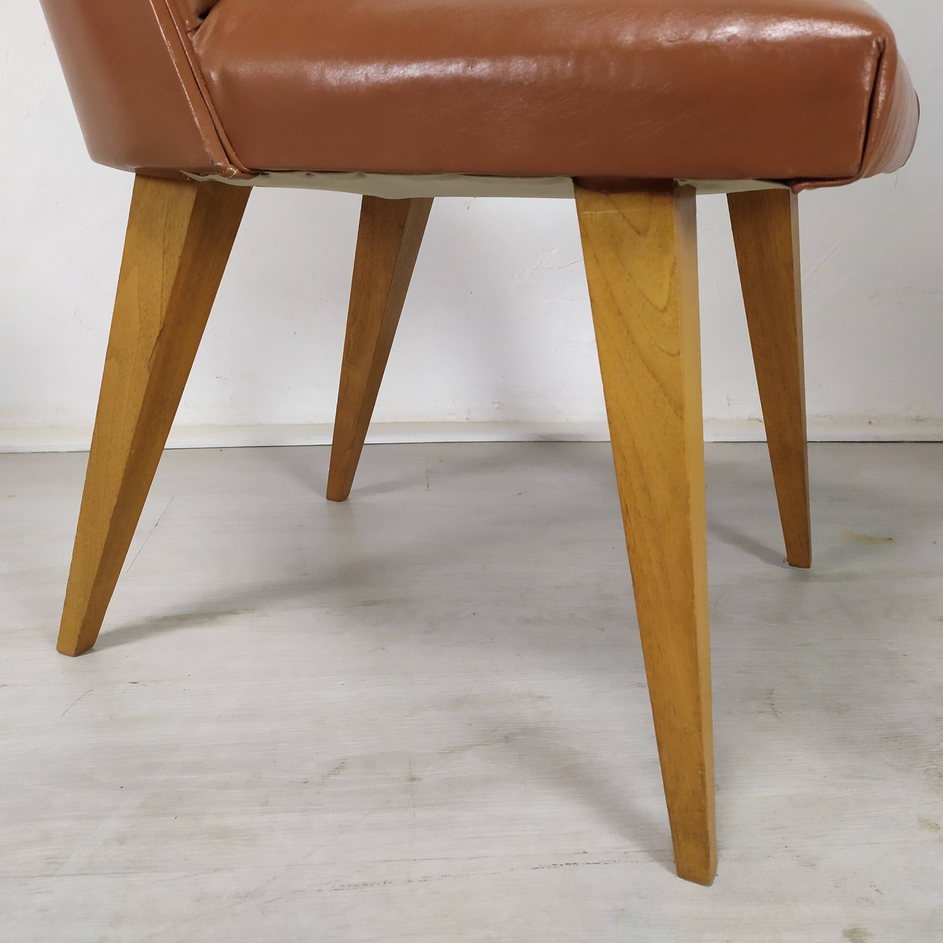 8 brown skai chairs 1950