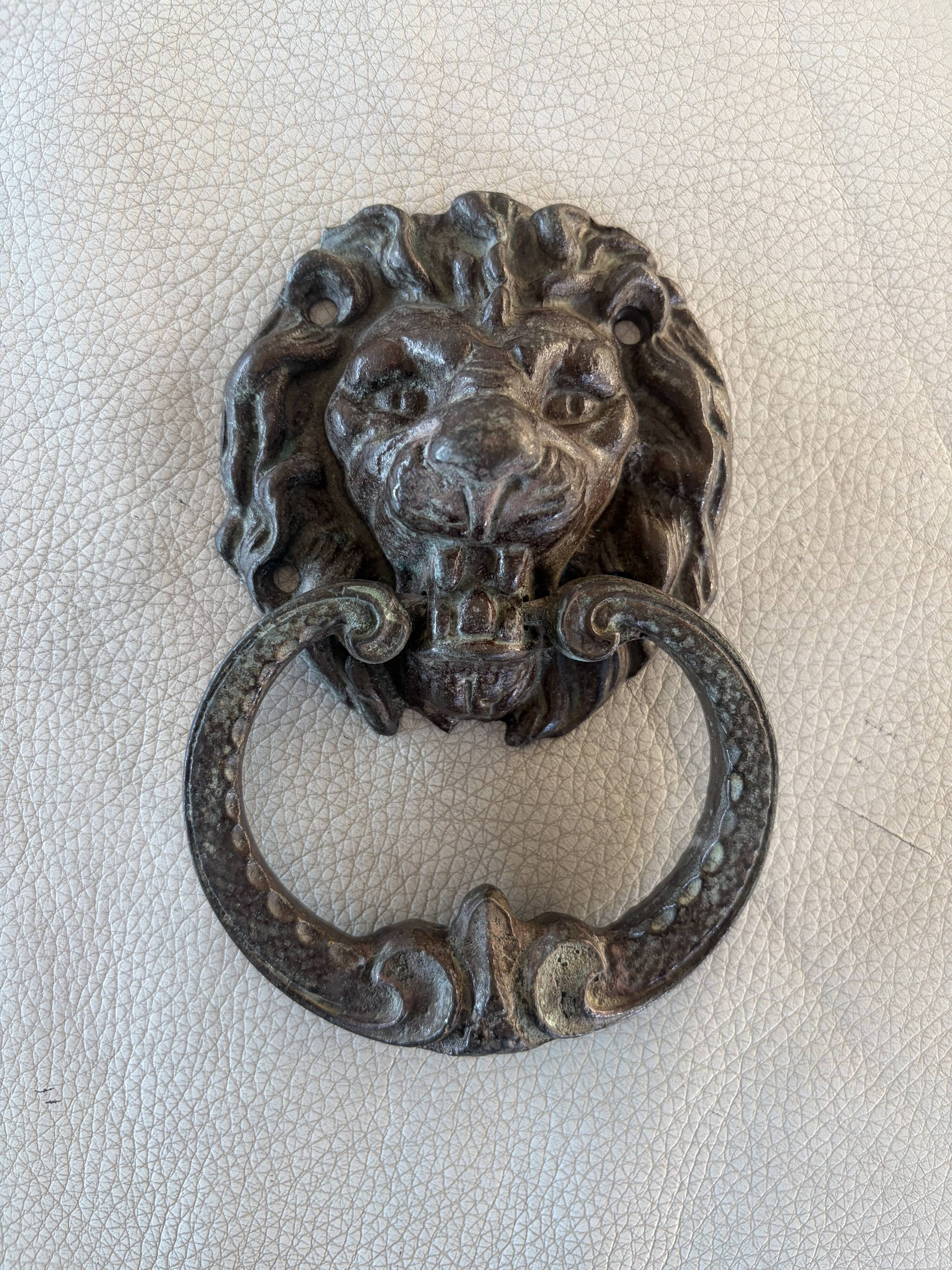 Bronze lion door knocker