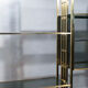 Brass laced library shelf by Kim Moltzer 1970
