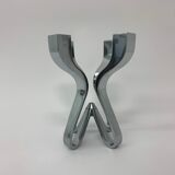 A chromed metal candle-holder "Chorus", design Karim Rashid, executed by Umbra / USA 2002