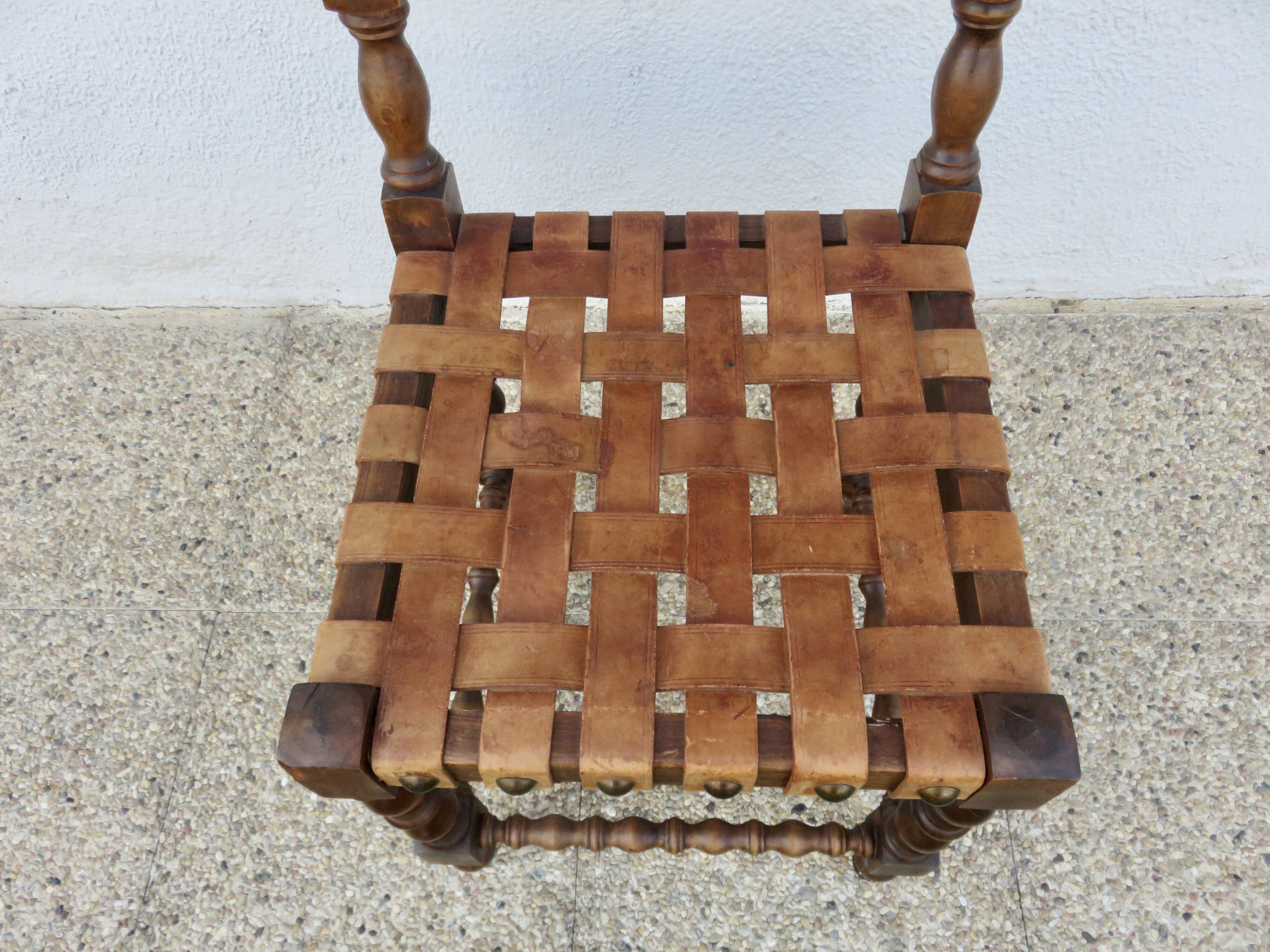 Spanish chair in oak with thick cognac leather straps, 1940s.