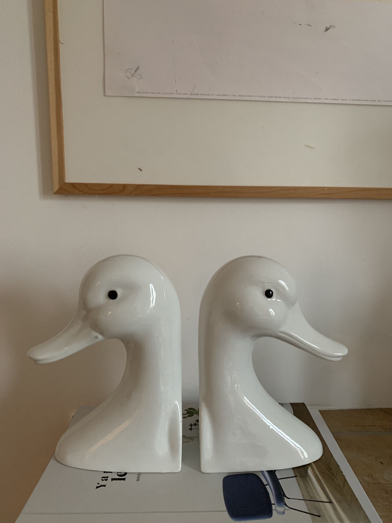 Vintage bookends in the shape of a goose or ceramic duck