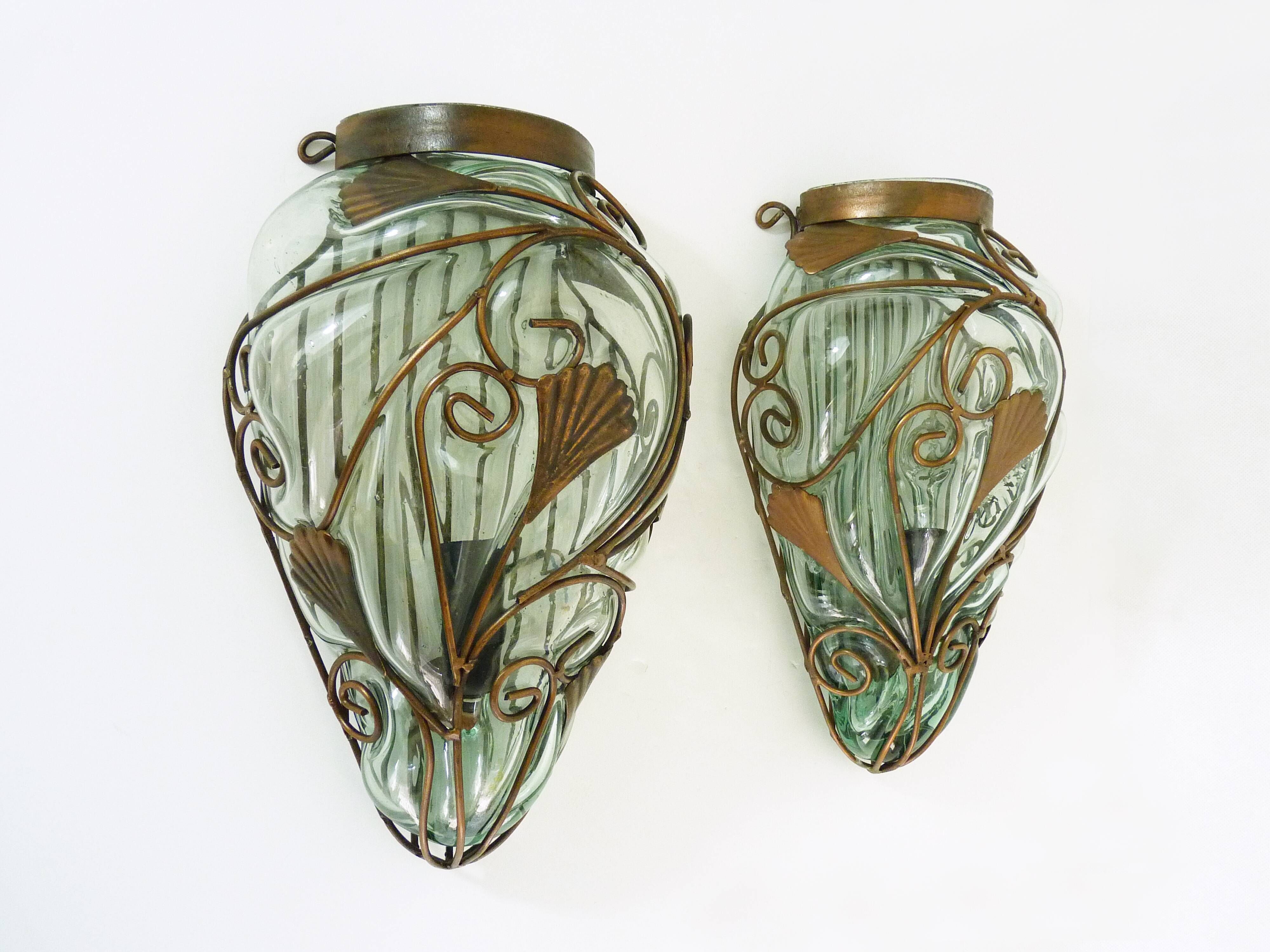 Pair of wall light cage in blown glass green color and wrought iron. Murano style. Year 80