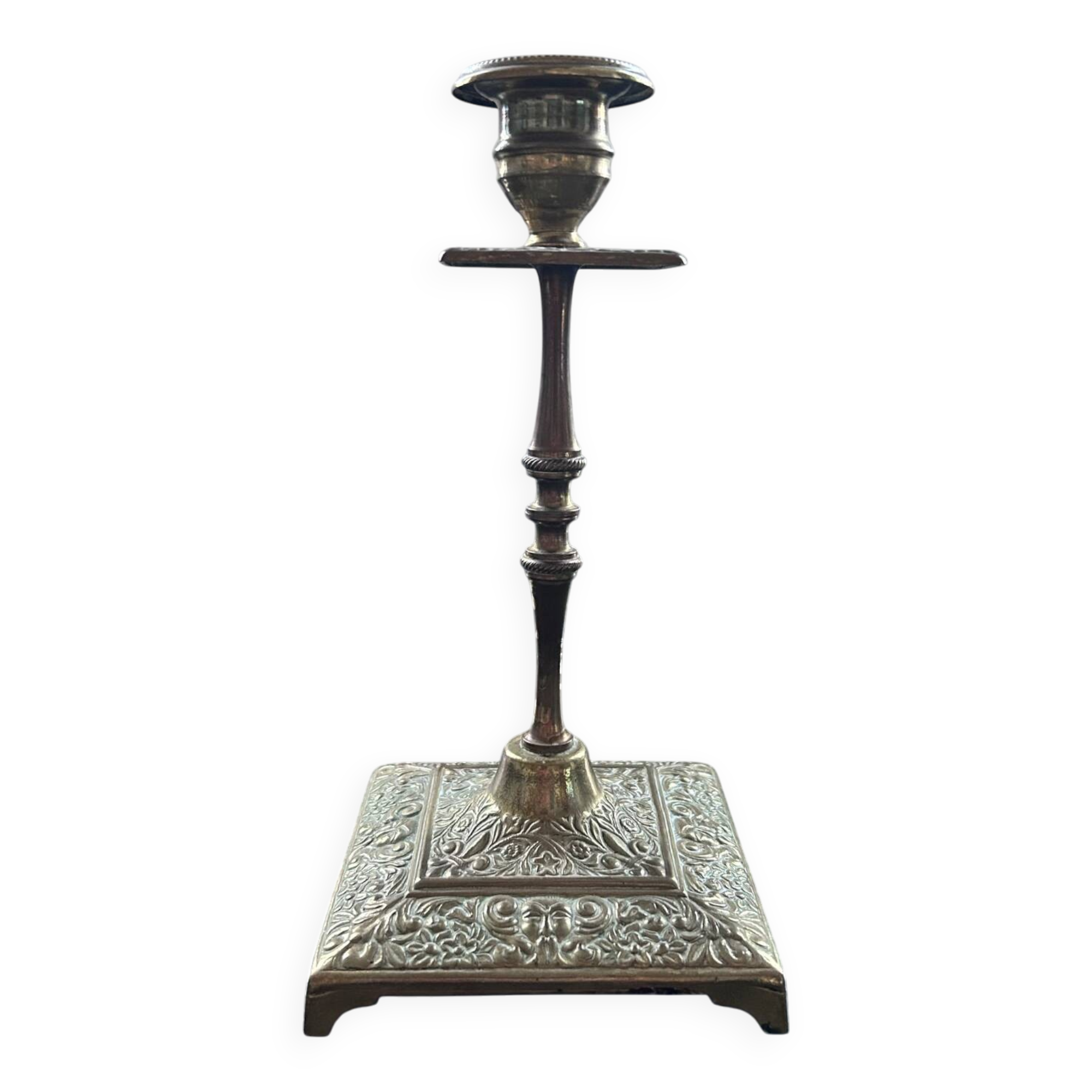 Chiseled brass candle holder