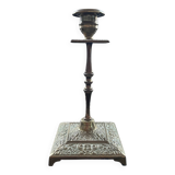 Chiseled brass candle holder