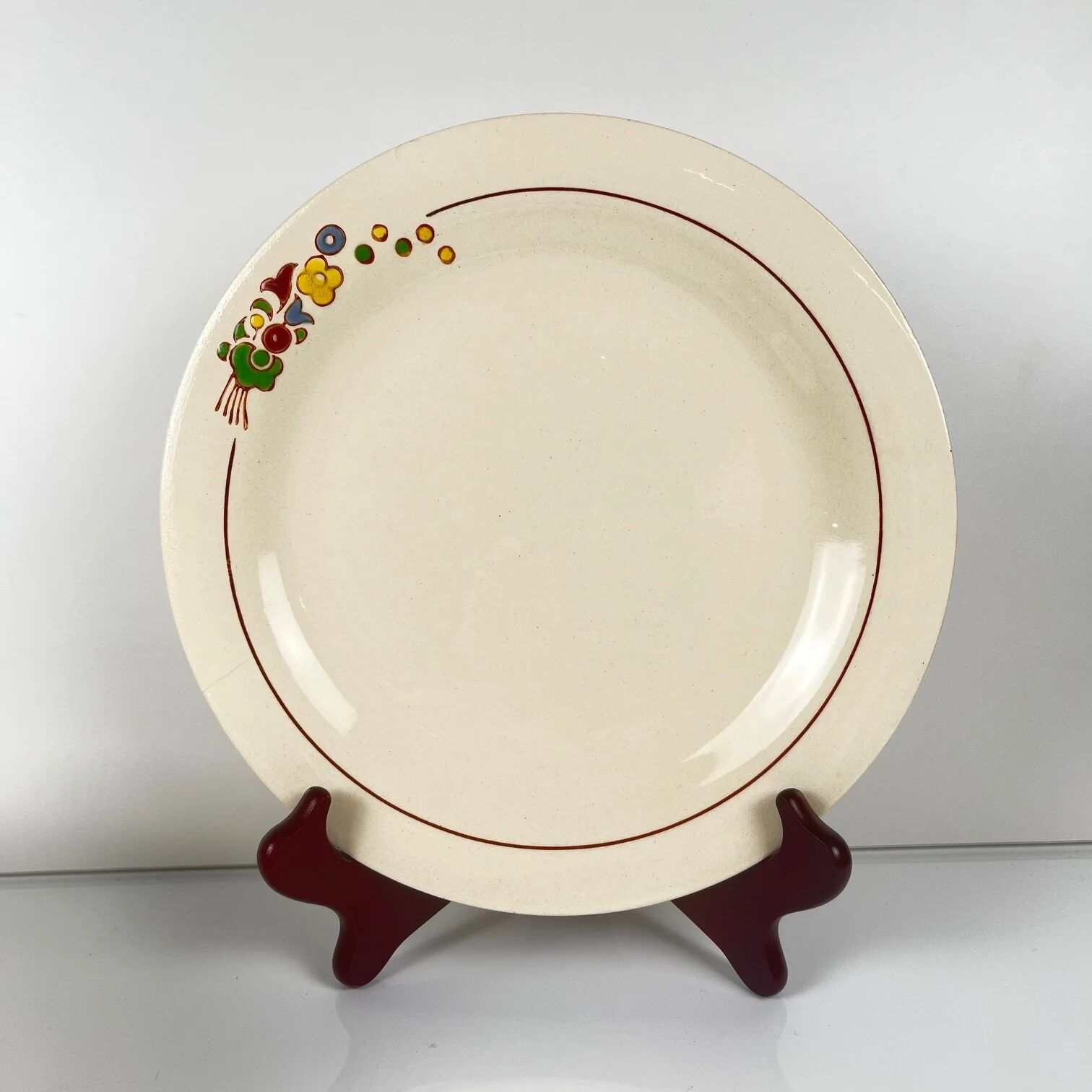 Set of 10 flat plates Longwy, 20th century, floral decoration.