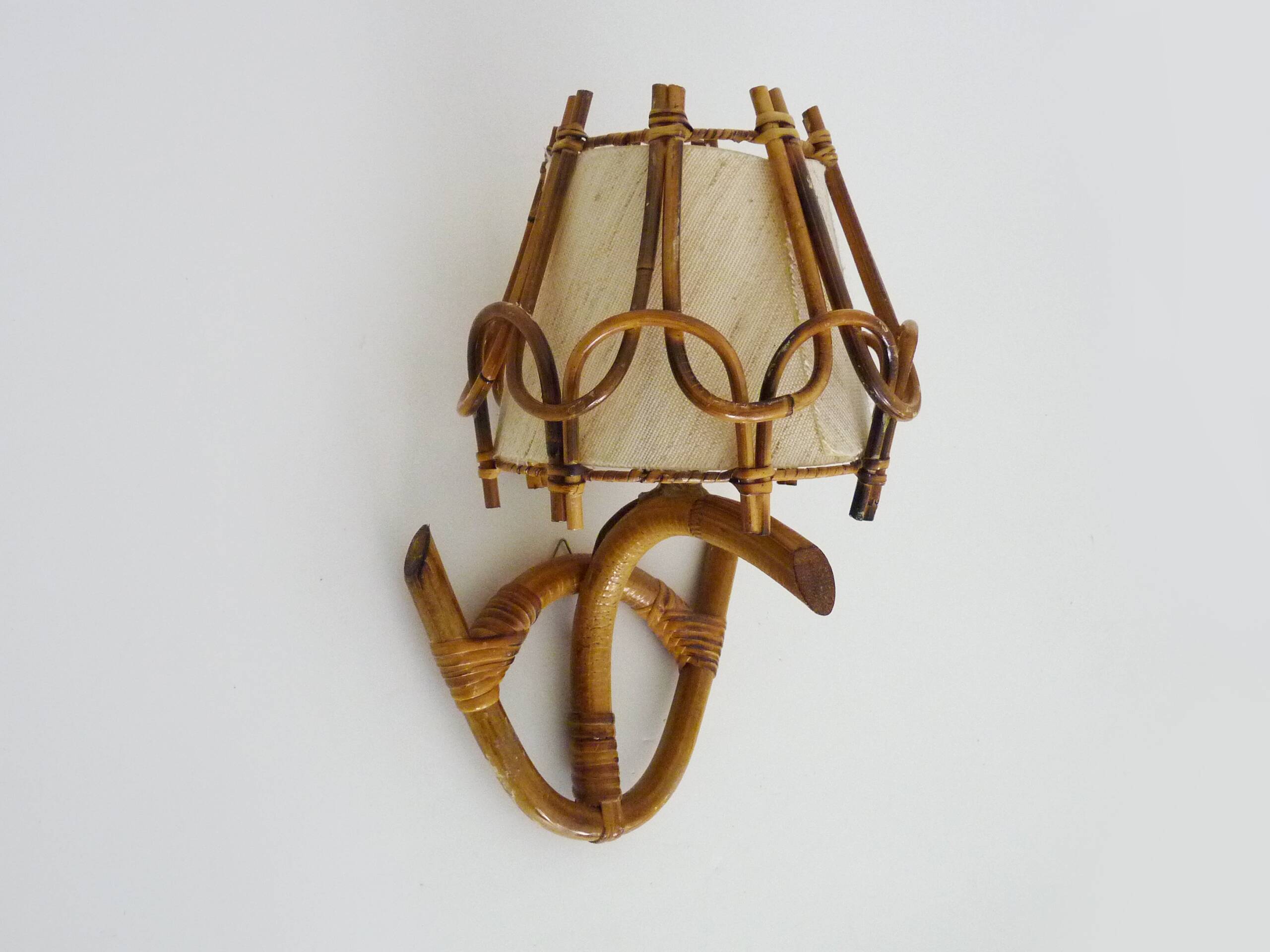 Louis Sognot rattan and bamboo wall light. 1950s