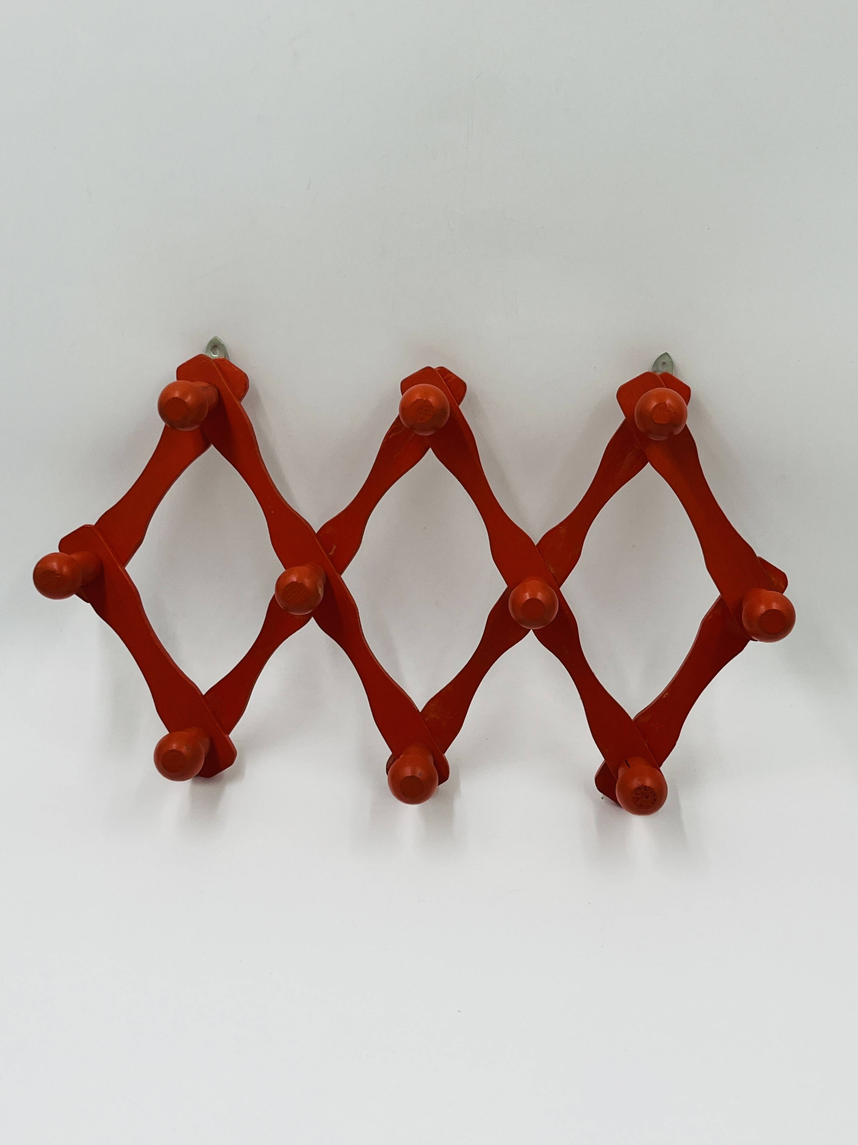 Vintage orange accordion coat rack