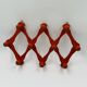 Vintage orange accordion coat rack