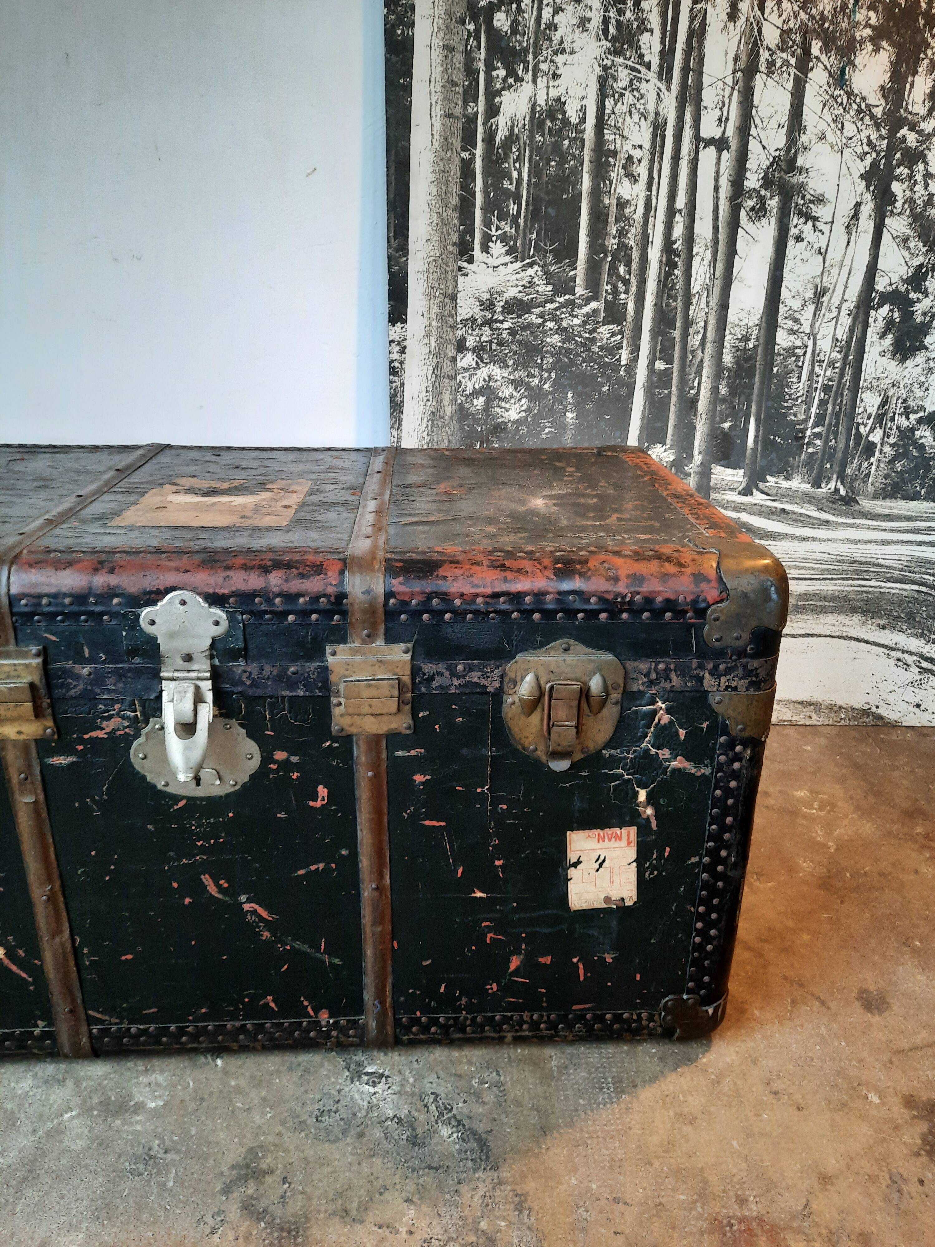 Old and large travel trunk, brass-plated corners