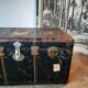 Old and large travel trunk, brass-plated corners