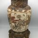 Old satsuma ceramic vase with various decorations mounted on bronze