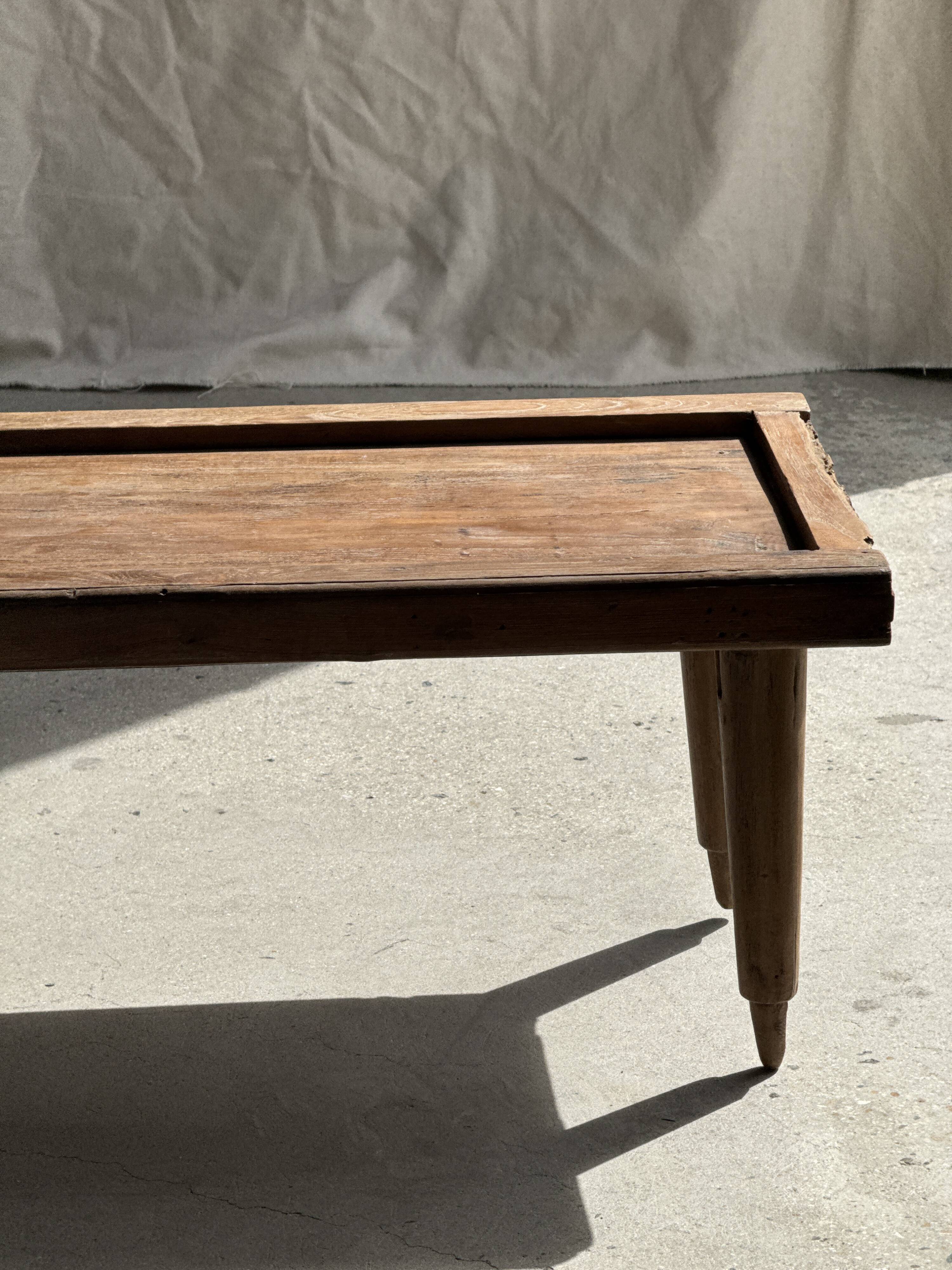 Coffee table with tapered legs in recycled antique teak H35 L104