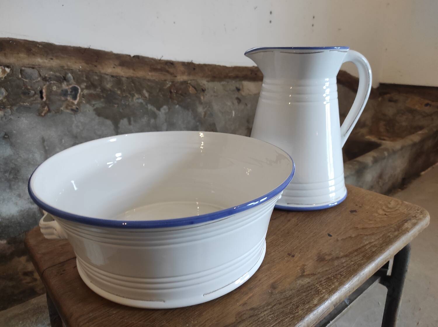 Large pitcher and enameled basin.